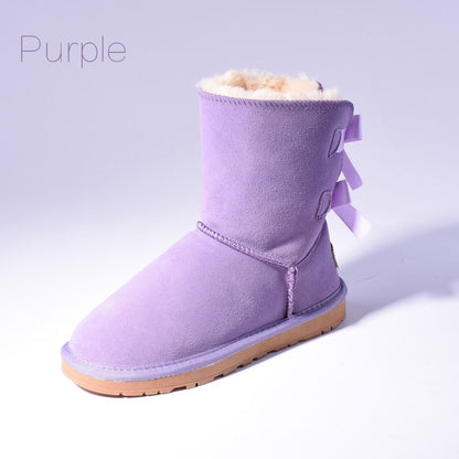 Women's mid-calf slip-on snow boots with bow detail
