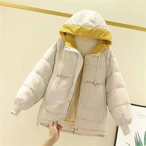 Woman wearing short padded winter coat with simple style