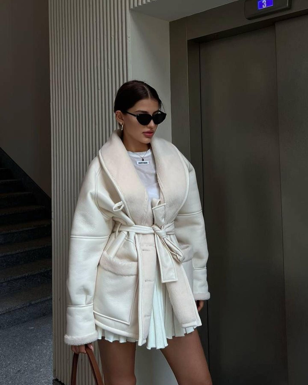 Women's loose faux leather long sleeve coat with pockets