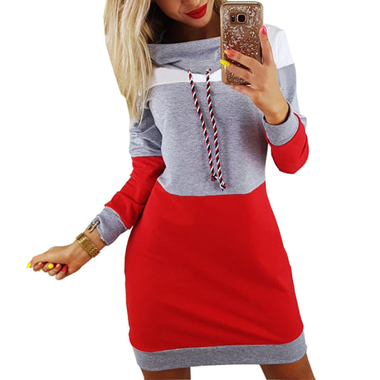 Woman wearing gray hooded long sleeve sweatshirt dress