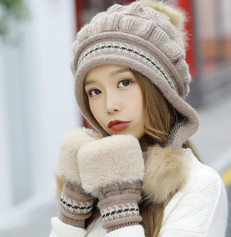 Women's knit beanie with ear flaps and pompom