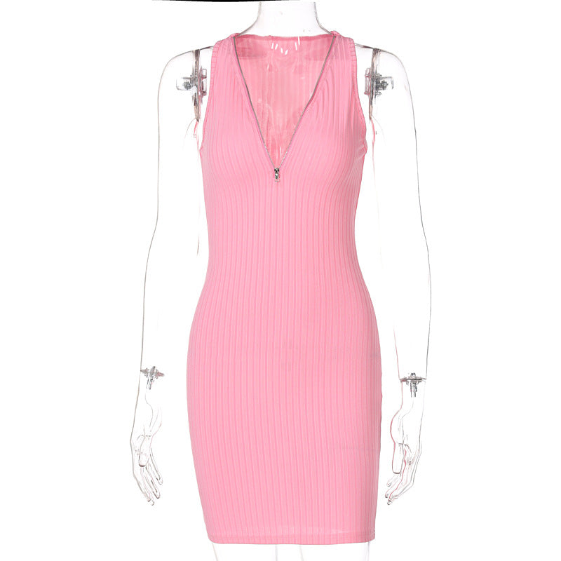 Woman wearing green and pink striped knit sleeveless mini dress