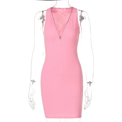 Woman wearing green and pink striped knit sleeveless mini dress
