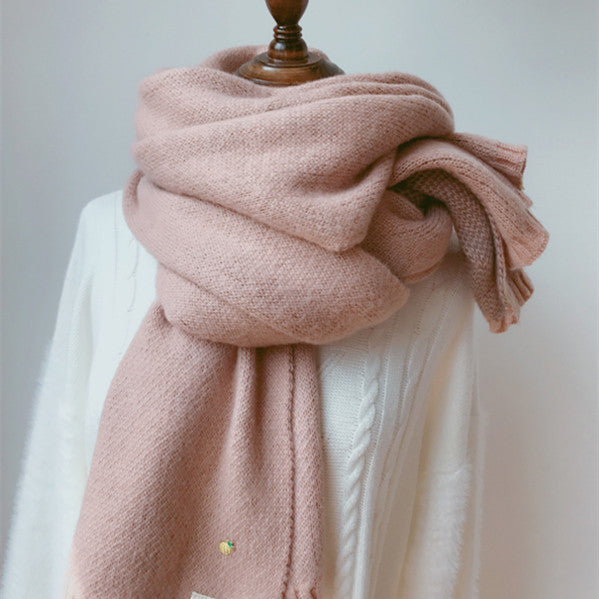 Woman wearing long winter scarf in imitation cashmere fabric