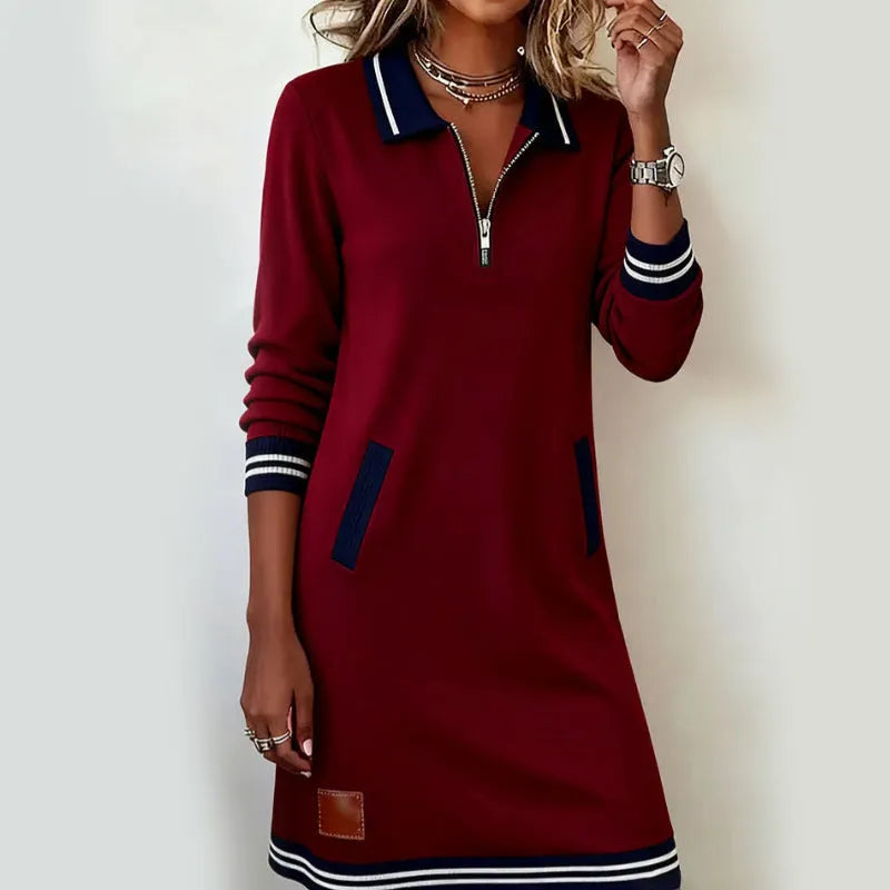 Woman wearing quarter zip polo mini dress with front pockets