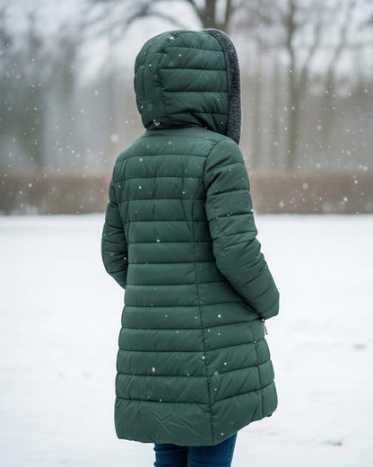 Woman wearing dark green fleece-lined A-line puffer coat