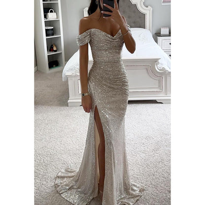 Woman in off-shoulder split party dress, solid color
