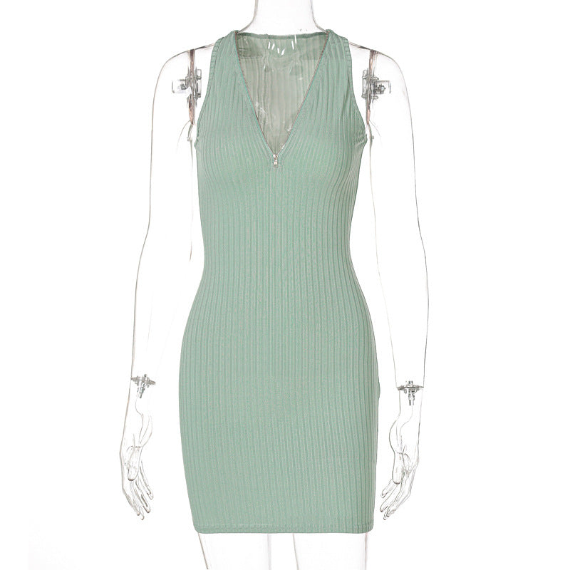 Woman wearing green and pink striped knit sleeveless mini dress
