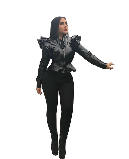 Woman wearing black leather jacket with ruffle edge