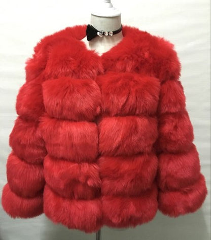 Woman wearing long faux fur winter coat outdoors