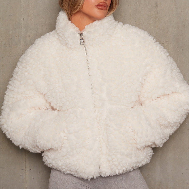 Woman wearing short open-front cardigan jacket indoors