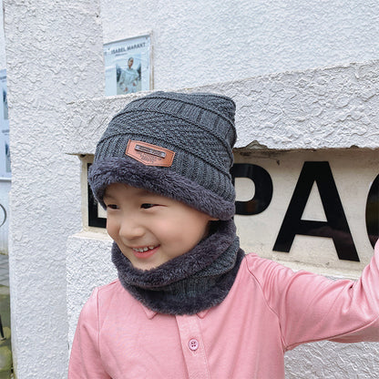 Women's knit beanie and scarf set in winter colors