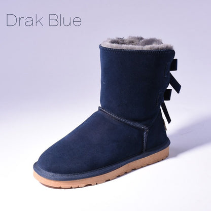 Women's mid-calf slip-on snow boots with bow detail