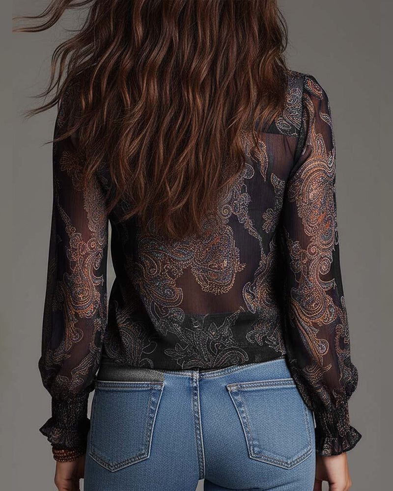 Woman wearing V-neck ruffle sleeve blouse with print