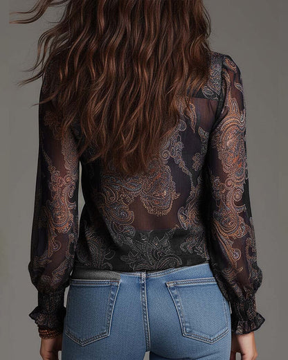 Woman wearing V-neck ruffle sleeve blouse with print