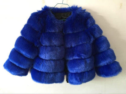 Woman wearing long faux fur winter coat outdoors