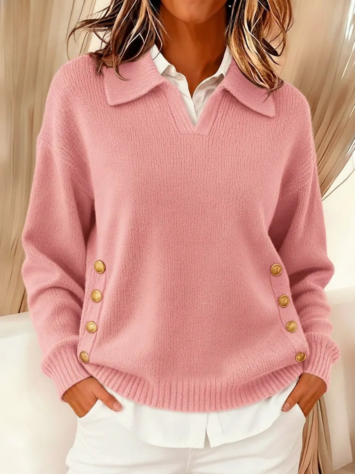 Woman wearing V-neck sweater with fold-over collar