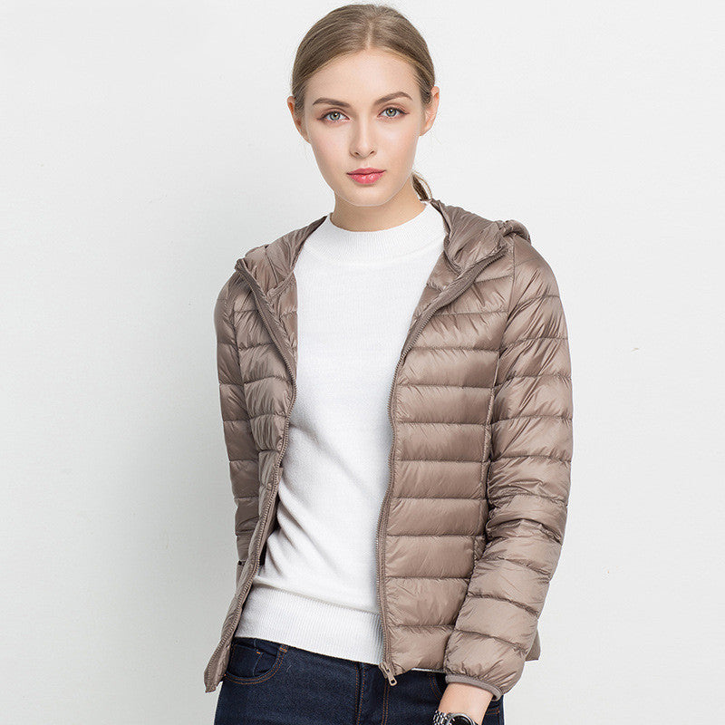 Woman wearing short hooded down jacket with zip front