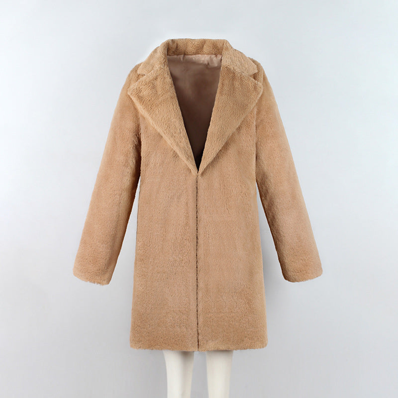 Woman wearing long faux fur coat streetwear