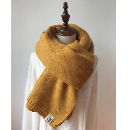 Woman wearing long winter scarf in imitation cashmere fabric