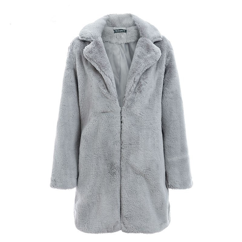 Woman wearing long faux fur coat streetwear