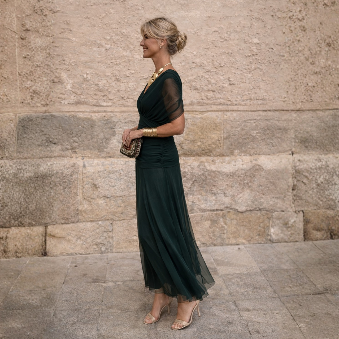 Woman wearing long flowing maxi dress with V-neck