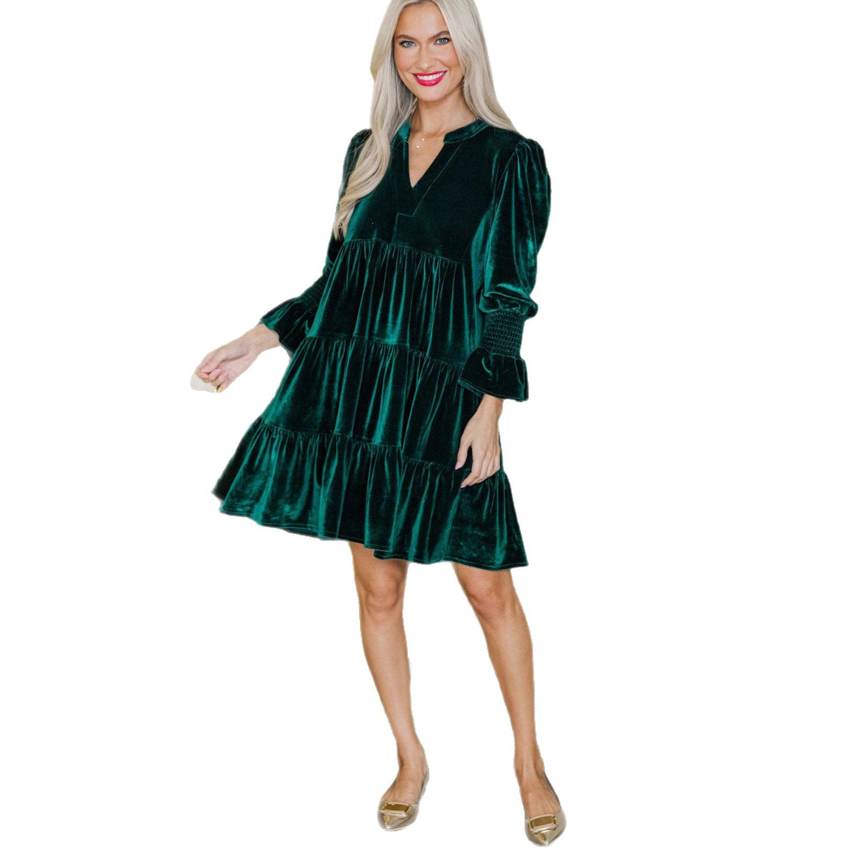 Woman wearing velvet V-neck mini dress with puffy sleeves
