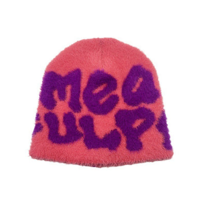 Woman wearing knit beanie hat in winter outfit