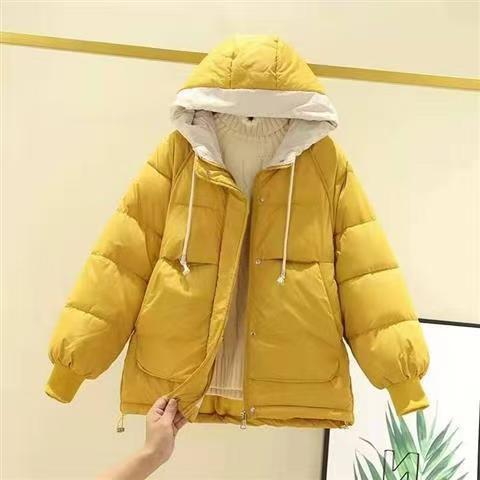 Woman wearing short padded winter coat with simple style