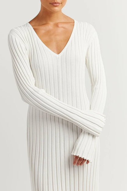 Woman wearing knit V-neck long sleeve dress