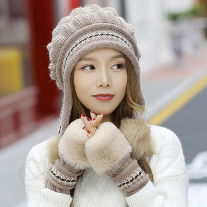 Women's knit beanie with ear flaps and pompom