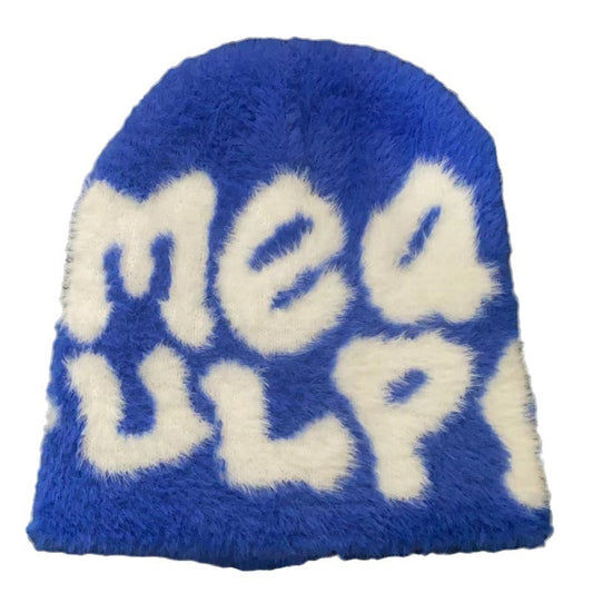 Woman wearing knit beanie hat in winter outfit