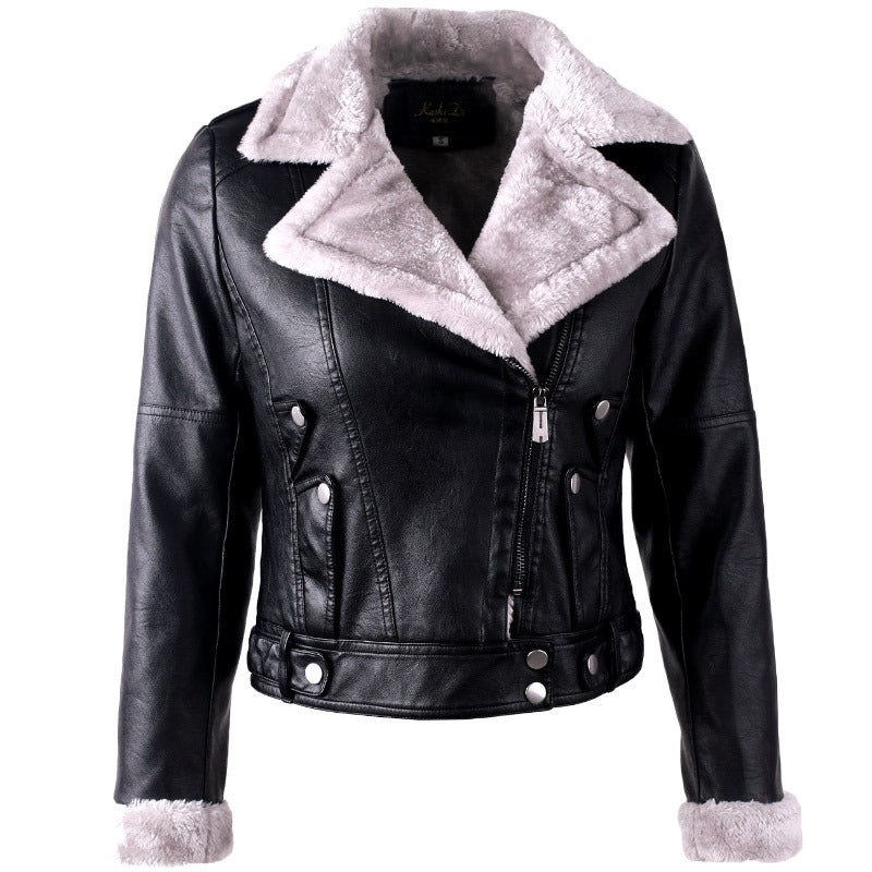 Woman wearing black faux leather jacket with velvet details