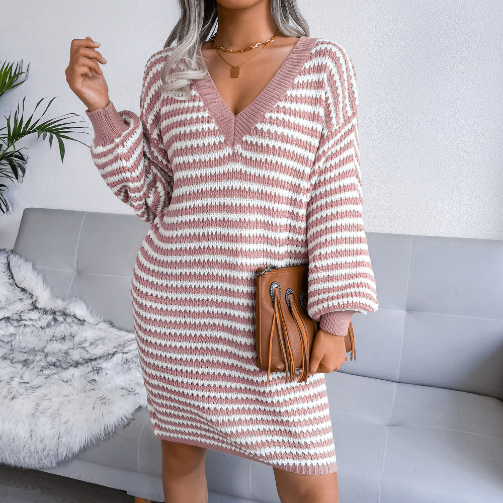 Woman wearing striped V-neck long sleeve sweater dress