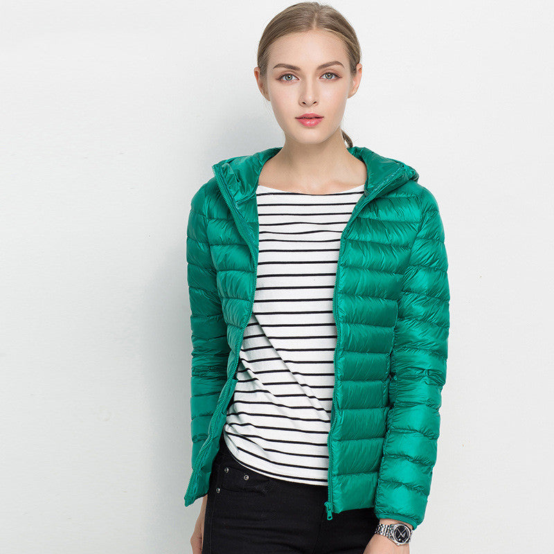 Woman wearing short hooded down jacket with zip front
