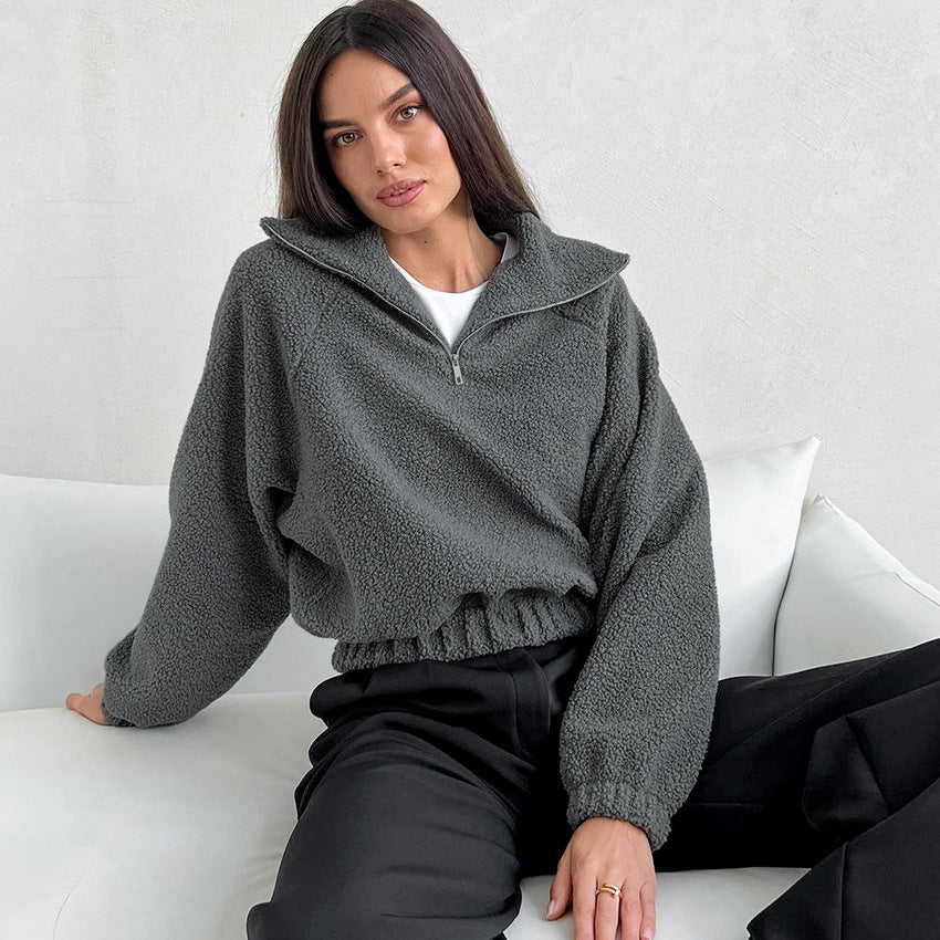 Woman wearing gray lamb fleece jacket with jeans