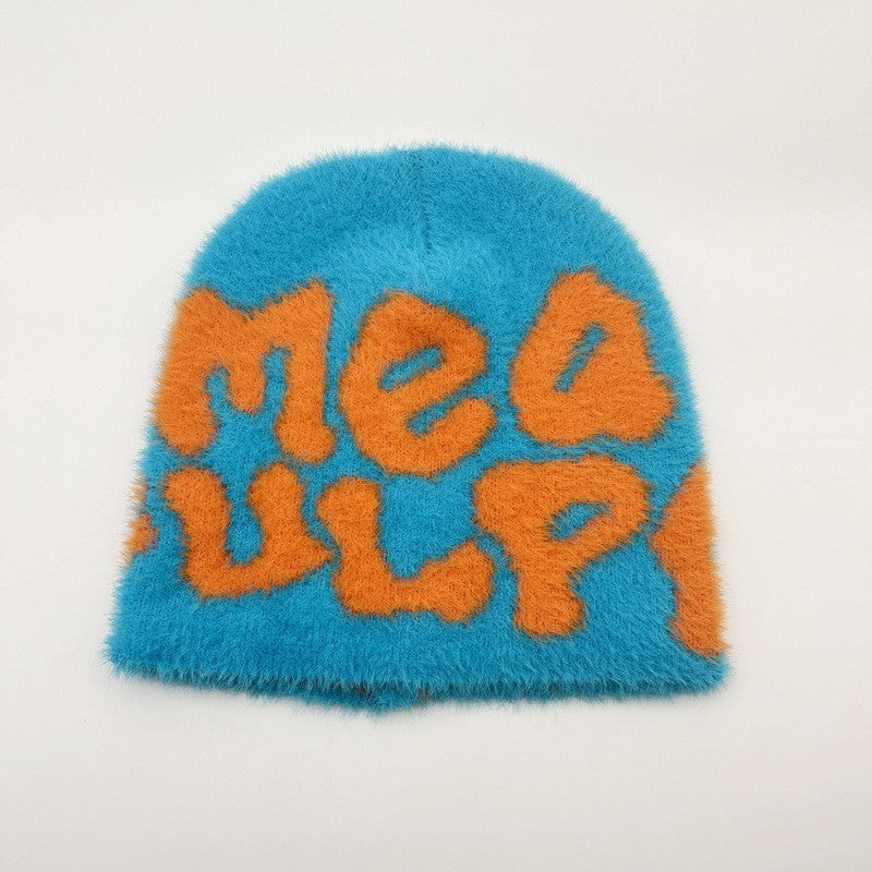 Woman wearing knit beanie hat in winter outfit