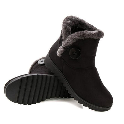 Women's ankle snow boots with platform sole and button closure