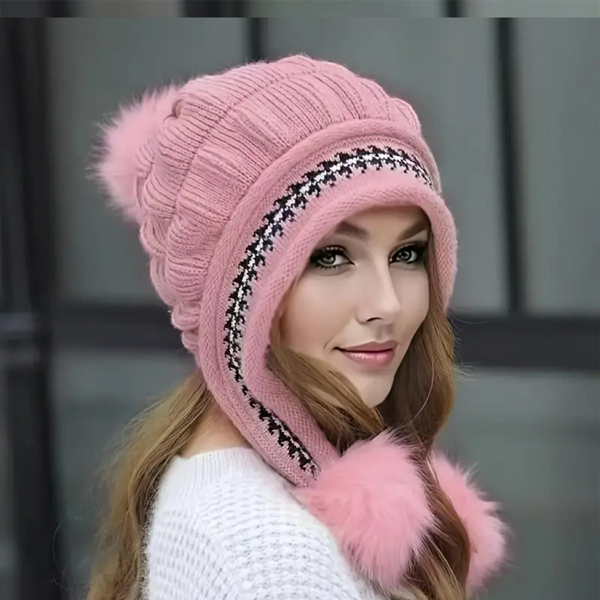 Women's knit beanie with ear flaps and pompom