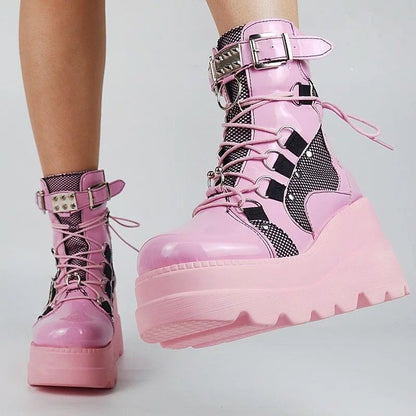Woman wearing pink platform wedge mid-calf boots