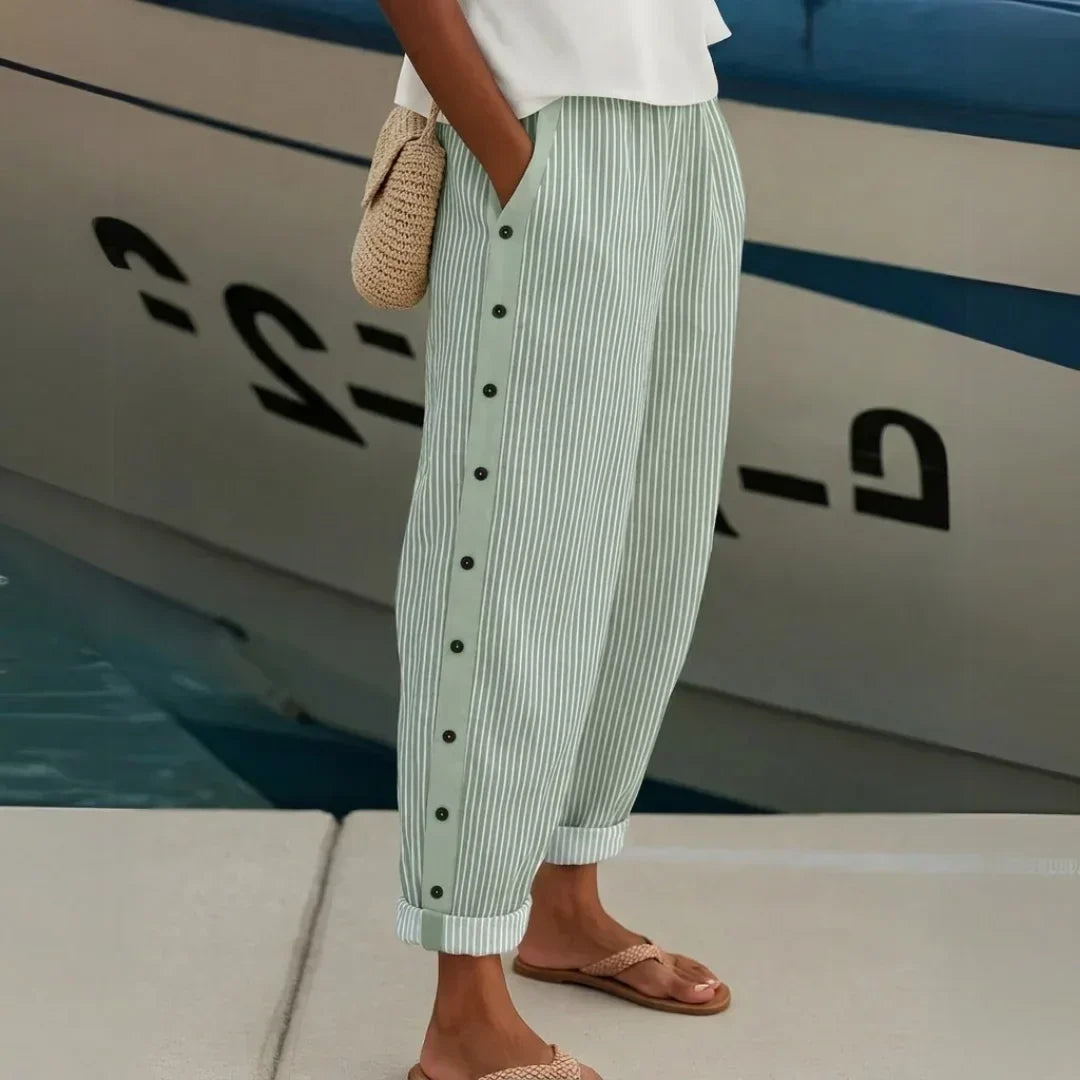 Woman wearing high-waisted striped button pants