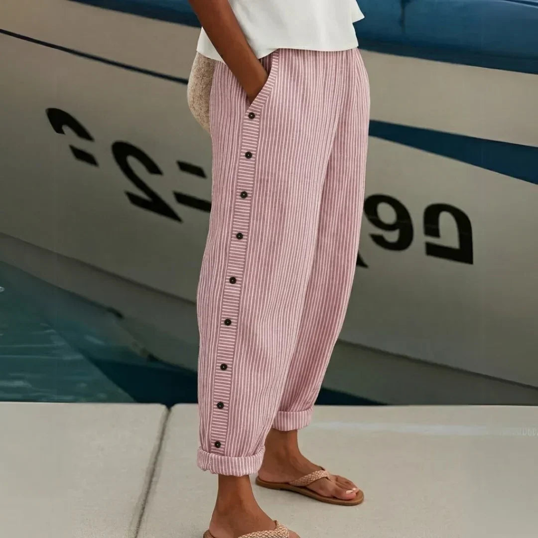 Woman wearing high-waisted striped button pants