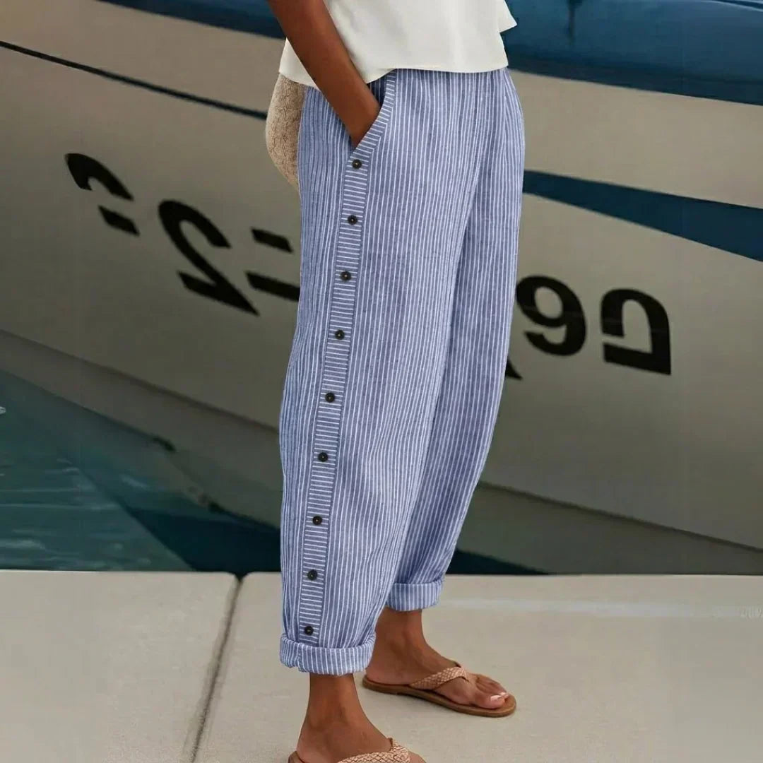 Woman wearing high-waisted striped button pants