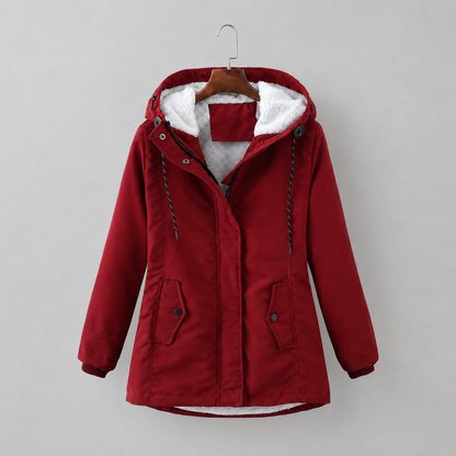 Woman wearing long quilted winter coat with hood