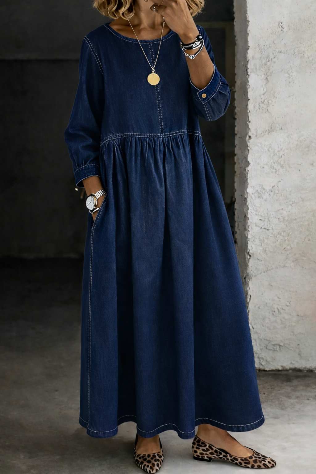 Woman wearing long sleeve gathered waist maxi dress