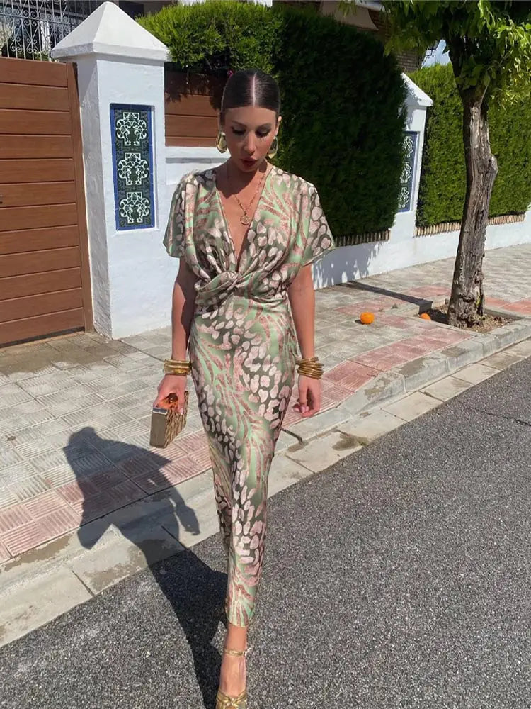 Woman in maxi dress with V-neck and wrap waist