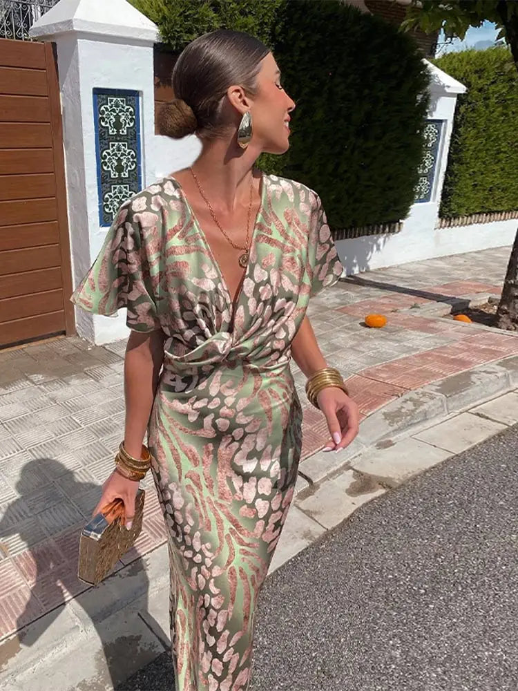 Woman in maxi dress with V-neck and wrap waist