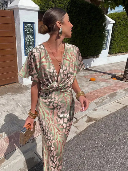 Woman in maxi dress with V-neck and wrap waist