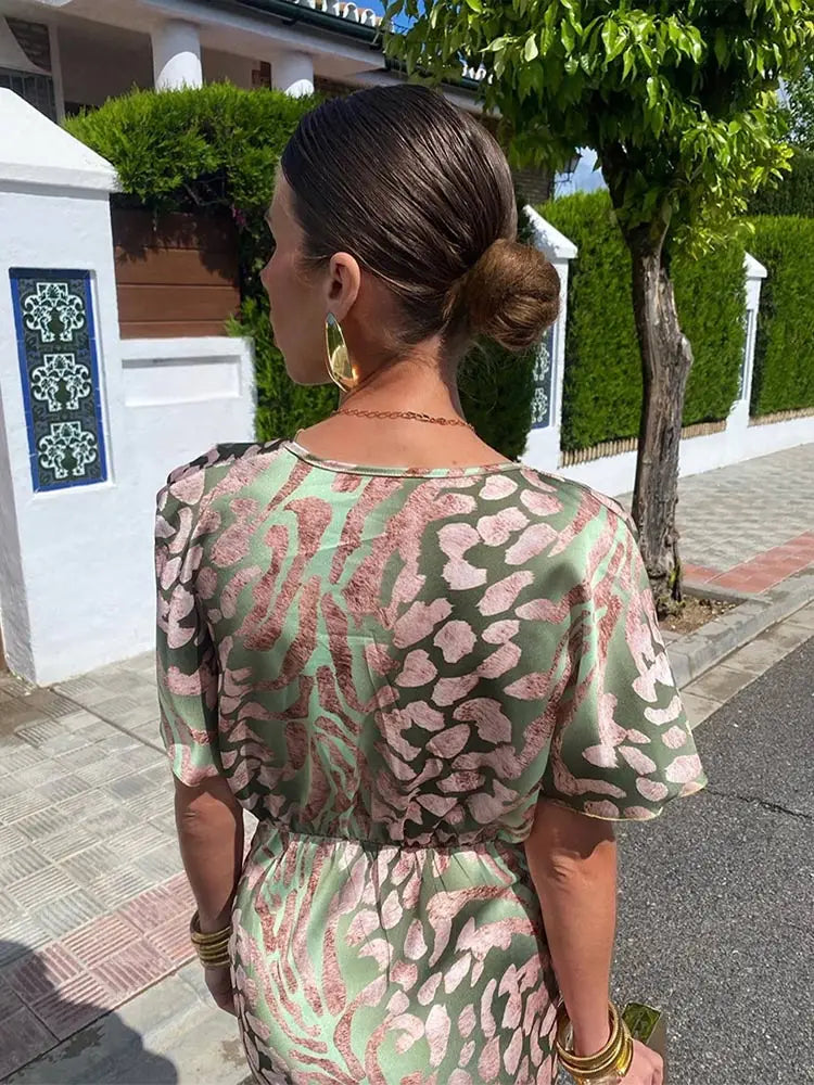 Woman in maxi dress with V-neck and wrap waist