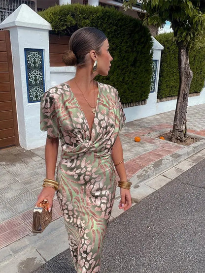 Woman in maxi dress with V-neck and wrap waist